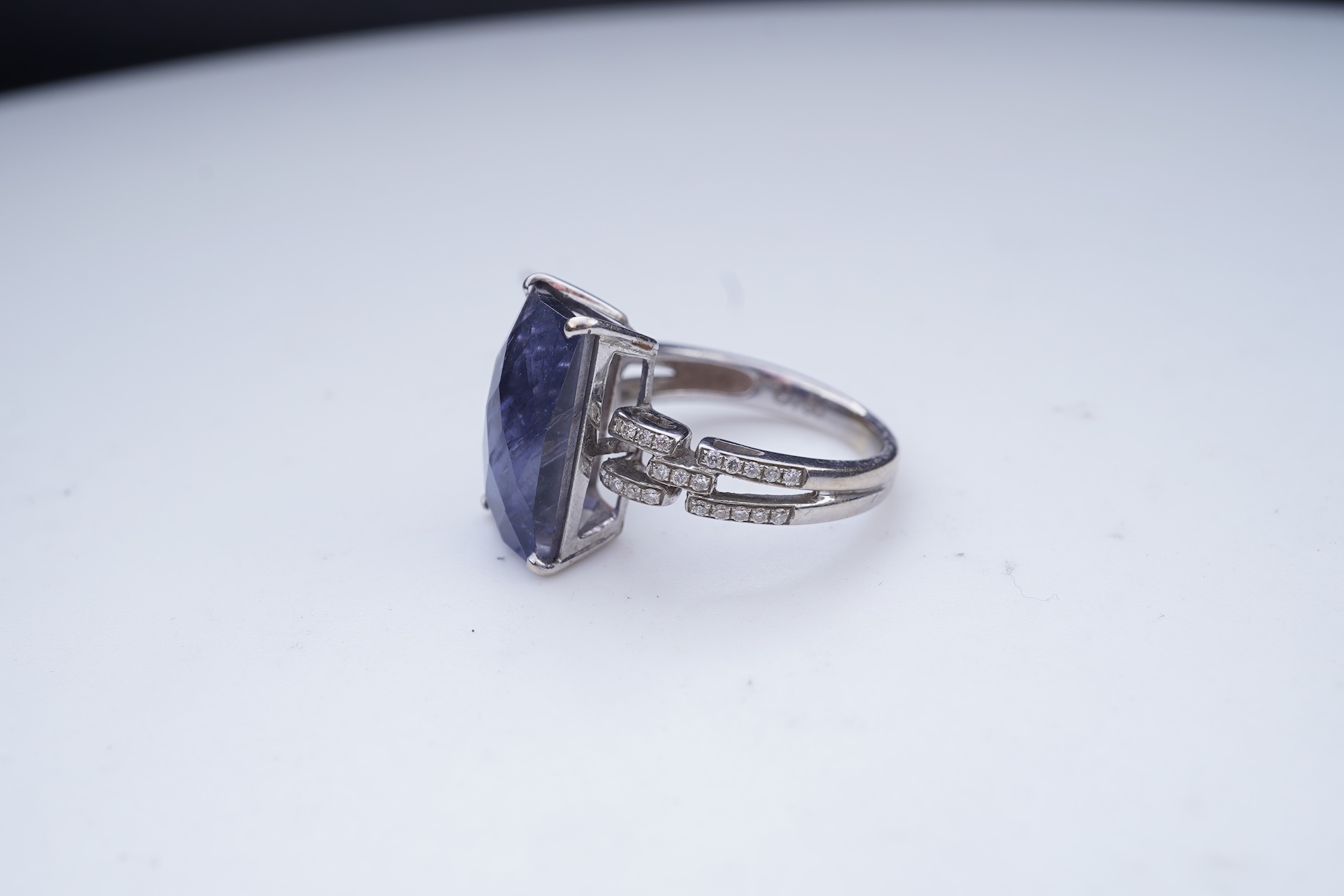 An iolite and diamond ring